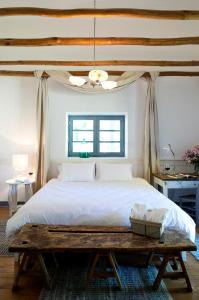 Кровать или кровати в номере NOI Blend Colchagua