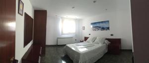 a small room with a bed and a window at Ruralfranxuli in Avellanes +24 photos