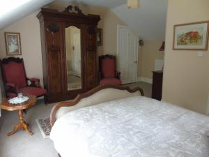 Postel nebo postele na pokoji v ubytování Hartley House B&B