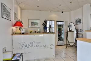 a shop with a counter with a sign on the wall at Le Panoramic Boutique Hôtel in Nice
