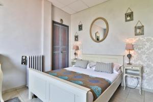 Postel nebo postele na pokoji v ubytování Le Panoramic Boutique Hôtel