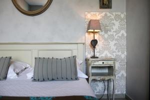 Postel nebo postele na pokoji v ubytování Le Panoramic Boutique Hôtel