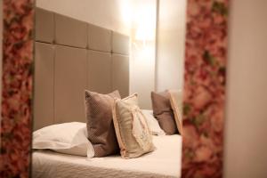 Postel nebo postele na pokoji v ubytování Le Panoramic Boutique Hôtel