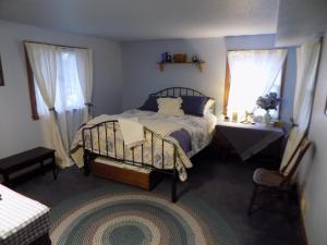 Säng eller sängar i ett rum på StoneWall House
