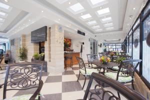 a dining room with a table and chairs at Hotel Casa Mahanaim Colferias, Bogotá in Bogotá