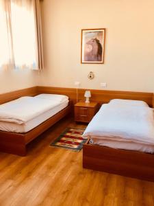 En eller flere senge i et værelse på Locanda Chiocciola