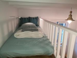 Кровать или кровати в номере Boulevard de la Mer 33 Apartam 11