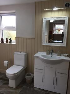 Een badkamer bij Mill Cottages