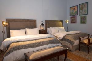 Tempat tidur dalam kamar di Estancia Argentina La Armonia