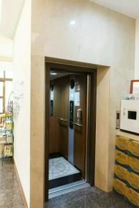 a hallway with a door in a room at Kenting Mulan Homestay in Hengchun South Gate