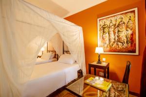 Un ou plusieurs lits dans un hébergement de l'établissement Mediterraneo Boutique Hotel