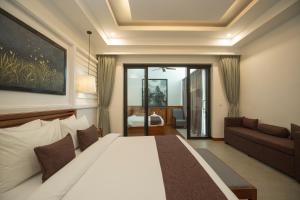 Voodi või voodid majutusasutuse The Tito Suite Residence toas