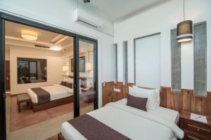 Voodi või voodid majutusasutuse The Tito Suite Residence toas