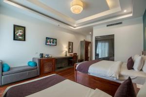 Voodi või voodid majutusasutuse The Tito Suite Residence toas