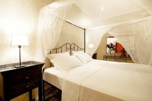 Un ou plusieurs lits dans un hébergement de l'établissement Mediterraneo Boutique Hotel