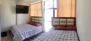 A-Hope Suite Hotel客房内的一张或多张床位