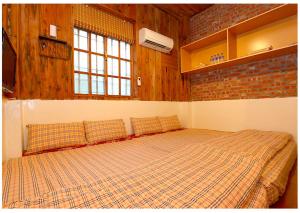 Cama o camas de una habitación en 初鹿敦親牧鄰民宿