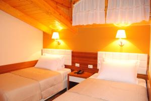 Cama o camas de una habitación en Hotel Vila 60