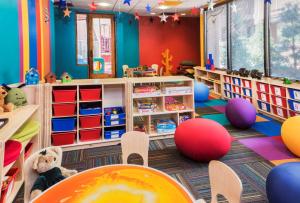a kindergarten classroom with colorful walls and tables and chairs at Hyatt Vacation Club at Pinon Pointe, Sedona in Sedona