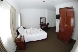 Letto o letti in una camera di Virtue Highland Hotel