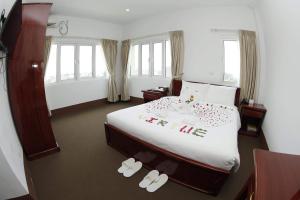 Letto o letti in una camera di Virtue Highland Hotel