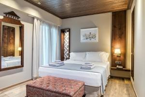 Posteľ alebo postele v izbe v ubytovaní Estia Boutique Apartments
