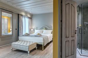 Posteľ alebo postele v izbe v ubytovaní Estia Boutique Apartments