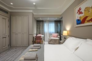 Posteľ alebo postele v izbe v ubytovaní Estia Boutique Apartments