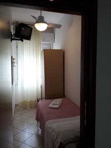 A bed or beds in a room at Hotel Penny