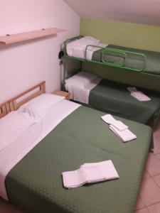 A bed or beds in a room at Hotel Penny