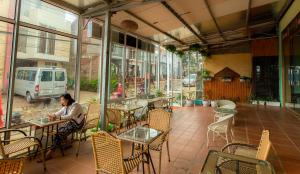 a woman sitting at a table in a restaurant at Viet Duc Guest House in Sapa