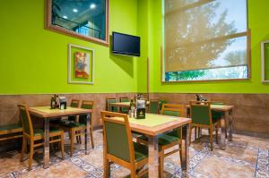 TV a/nebo společenská místnost v ubytování Hotel Julia