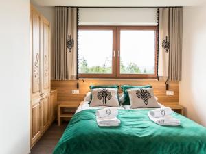 Posteľ alebo postele v izbe v ubytovaní Polana Szymoszkowa Ski Resort - Mountain View Apartments