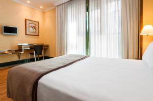 Postel nebo postele na pokoji v ubytování Hotel Julia