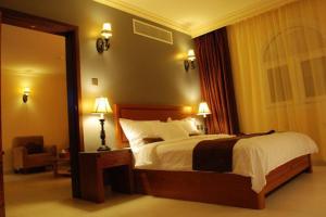 Ένα ή περισσότερα κρεβάτια σε δωμάτιο στο La Rosa Hotel By Brother International