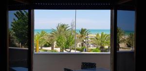 a view of the ocean from a window at casa fronte mare in Alba Adriatica