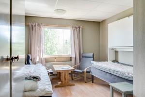 Ένα ή περισσότερα κρεβάτια σε δωμάτιο στο STF Vandrarhem Sälen