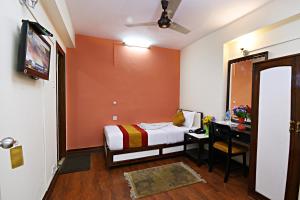 Hotel Pleasure Home tesisinde bir odada yatak veya yataklar