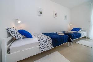 Postel nebo postele na pokoji v ubytování Guesthouse Klara
