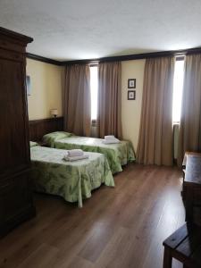Кровать или кровати в номере Hotel Tavernier
