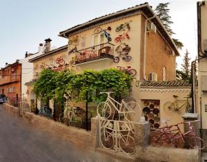 a building with bikes painted on the side of it at La Casa De Las Bicicletas in Cazorla