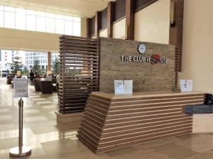 a lobby with a sign that reads the quick up at Wind Residences by Bea and RM in Tagaytay