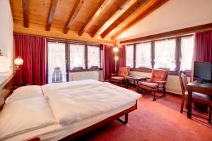 Postel nebo postele na pokoji v ubytování Hotel Astoria