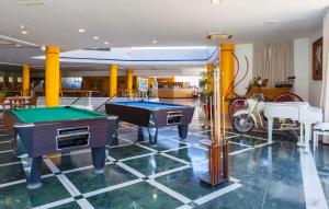 a room with two pool tables in a room at Hotel Mexico in Vera