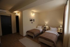 Letto o letti in una camera di Le Caucase