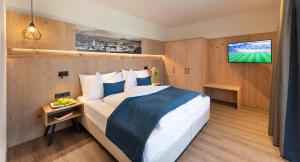 Postel nebo postele na pokoji v ubytování Hotel Christof