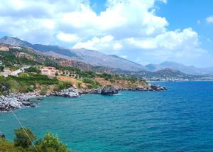 a view of a body of water with mountains at Creta Spirit in Plakias