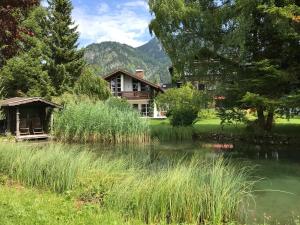 a house with a pond in front of a house at Holiday @ Bad Hindelang in Bad Hindelang
