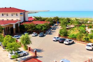 an aerial view of a parking lot with cars parked at Dostar Hotel in Aktau