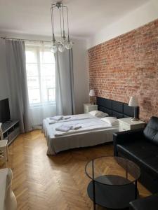 
Łóżko lub łóżka w pokoju w obiekcie Florianska Deluxe Apartments with Air Condition
